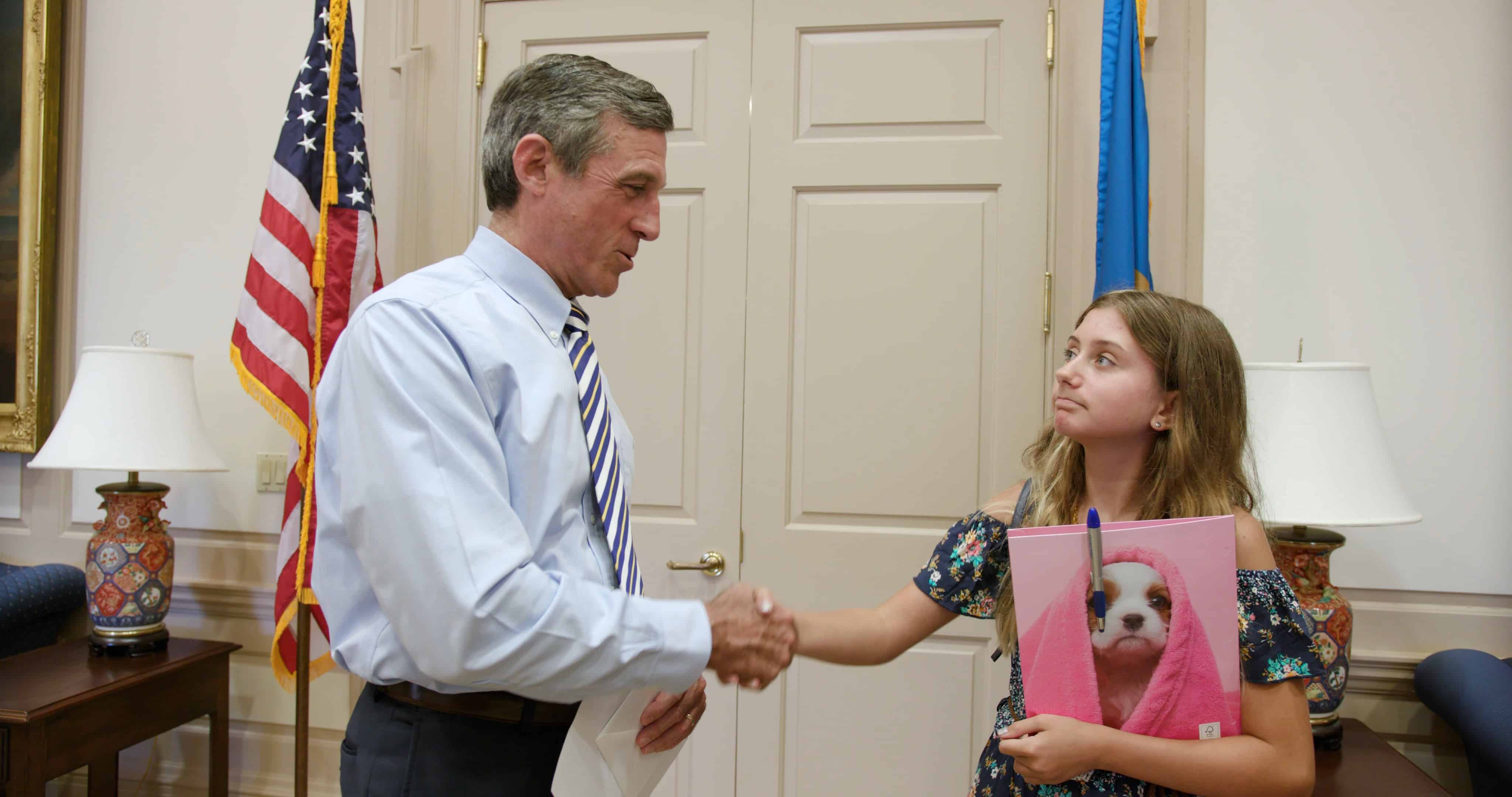 Rylie shakes hands with governor